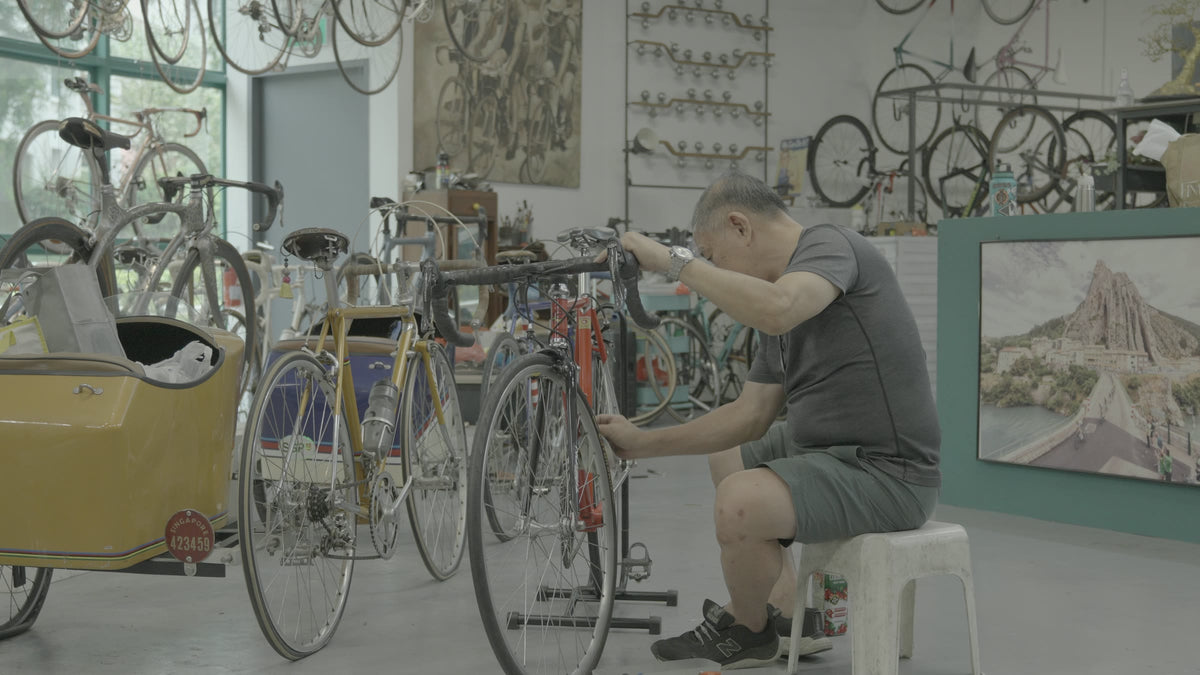 BikeCraft.One master mechanic servicing a classic road bike in the Soek Seng gallery