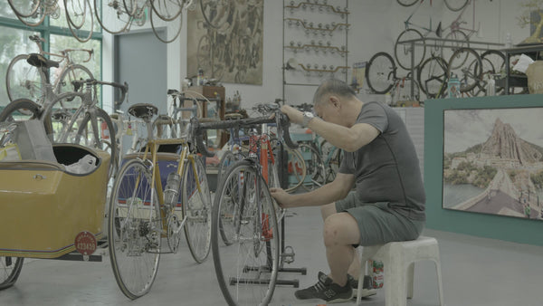 BikeCraft.One master mechanic servicing a classic road bike in the Soek Seng gallery