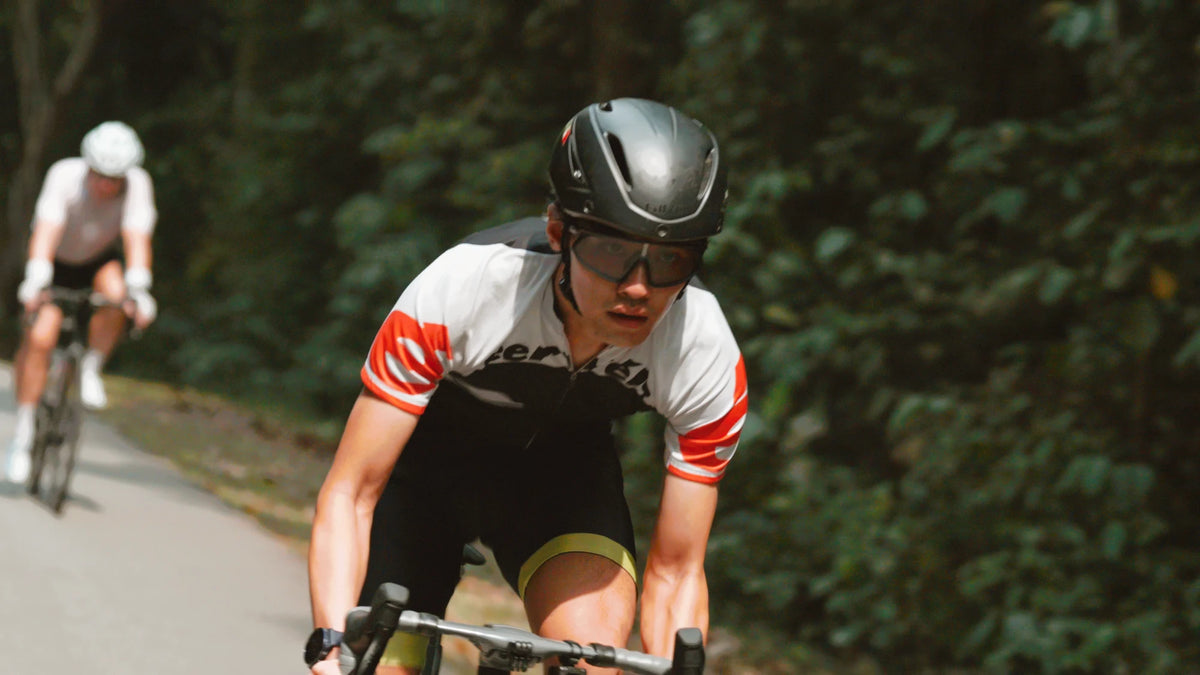 A cyclist riding on an open road